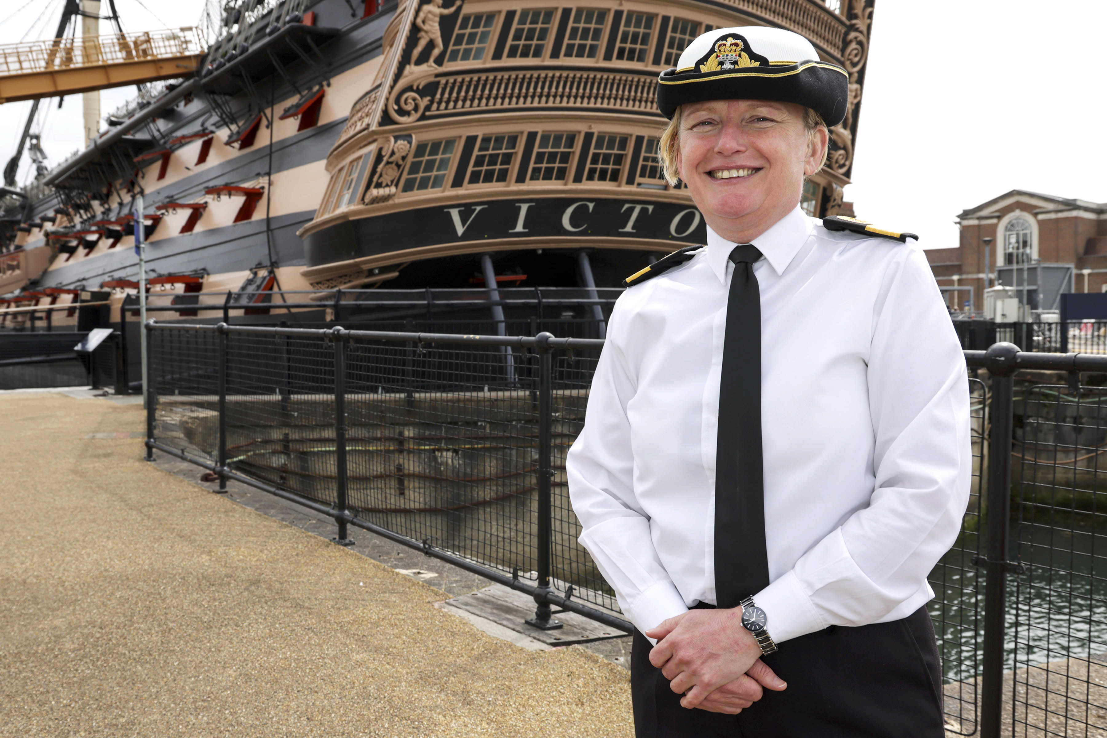 Commodore_Terry_in_front_of_HMS_Victory.jpg