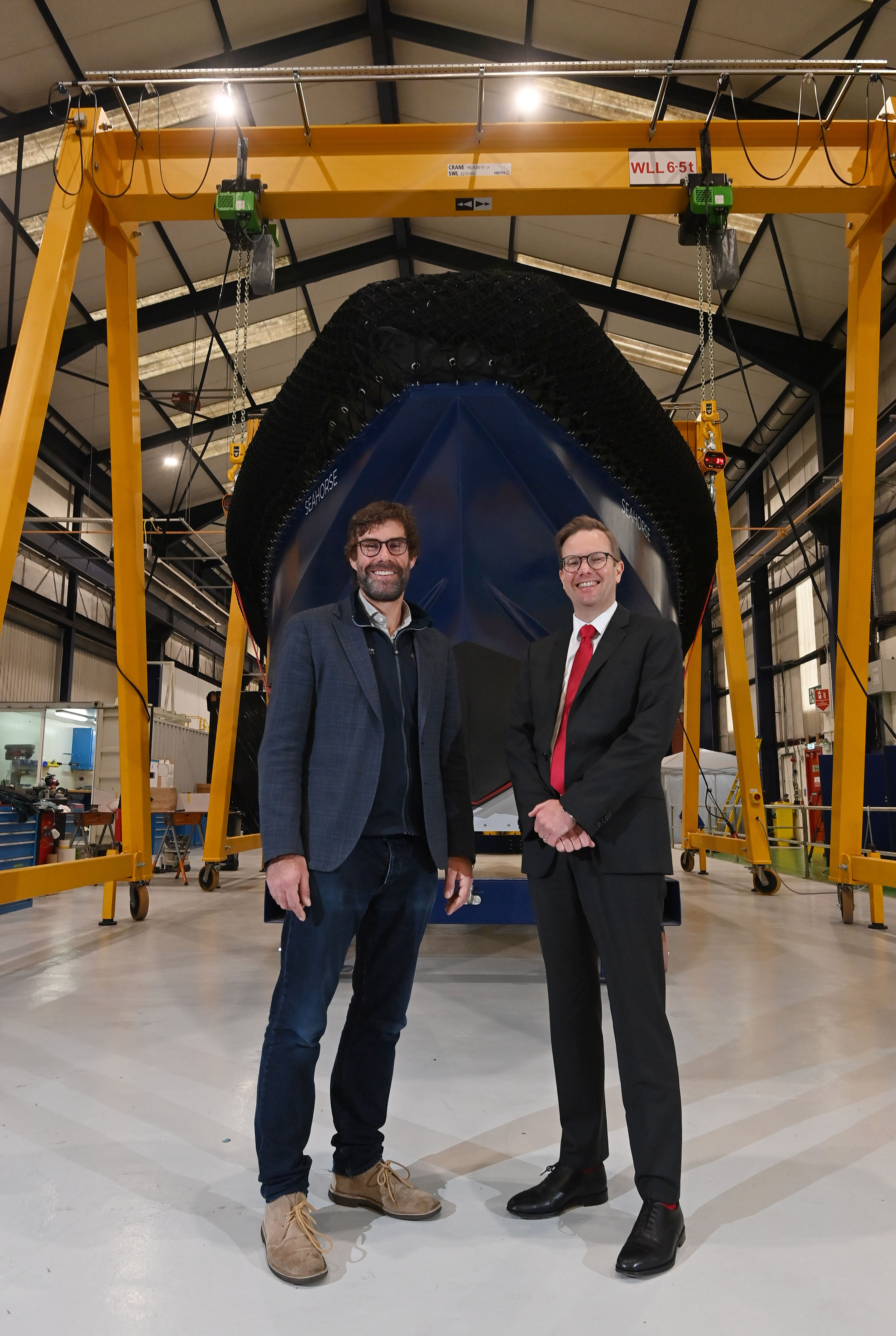 Dr Iain Percy OBE, CEO and Founder of Artemis Technologies and Elwyn Dop, Condor’s Operations Director, with the first Artemis eFoiler(R) propelled prototype, an 11m workboat.