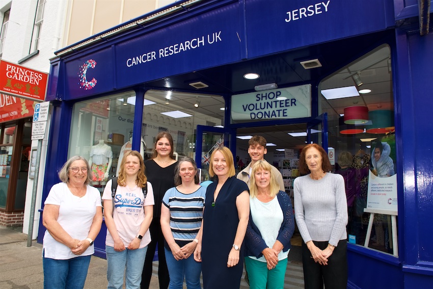 cancerresearchMichelle_Mitchell_centre_with_Jersey_CRUK_shop_staff_and_volunteers.jpg