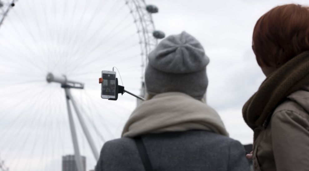 There is a website that tells you whether or not you can bring a selfie stick to attractions