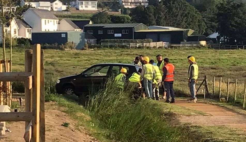 Wrong turn! Workmen to the rescue as car narrowly misses brook