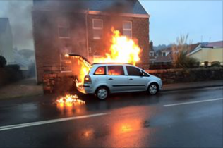 Elderly woman saved from burning car