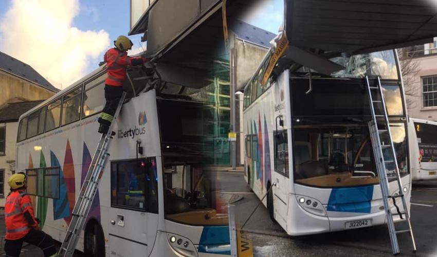 Double decker hits bus station