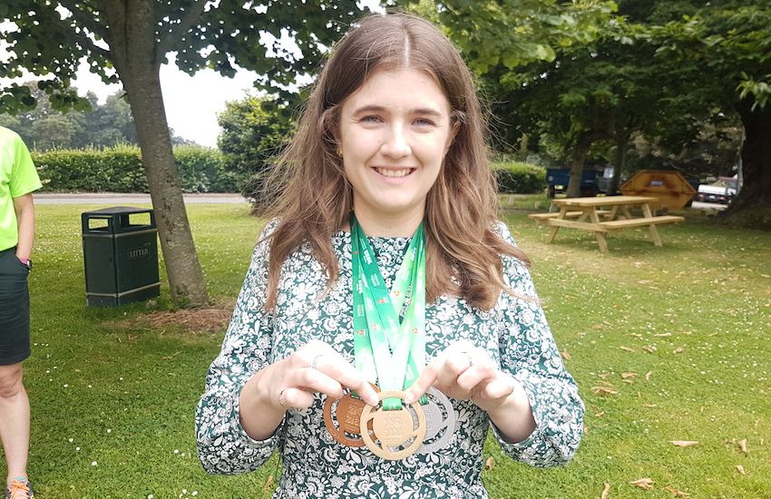 Island Games medals designer from Guernsey models her creations