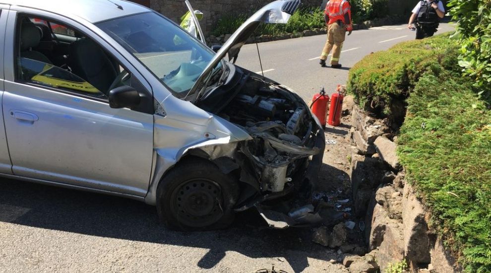 Two in hospital after car crashes head-on into granite wall