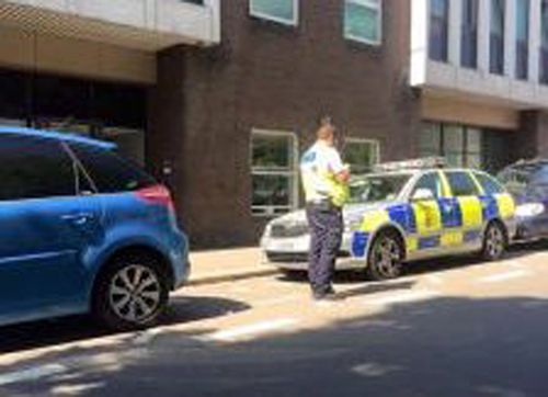 Jersey Police hold hands up after getting a parking ticket