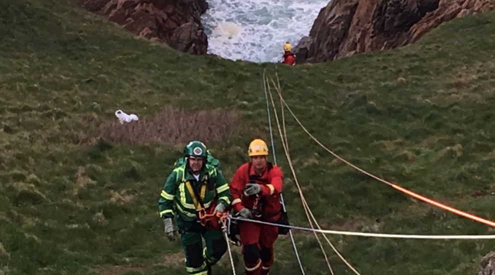 Cliff rescue: helicopter winches woman to safety