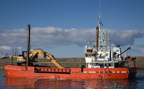 5,000 cubic metres of muck being dredged out of the harbour