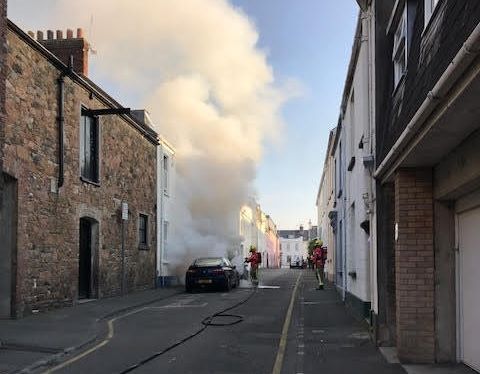 Fire services battle a two-car fire in St Helier