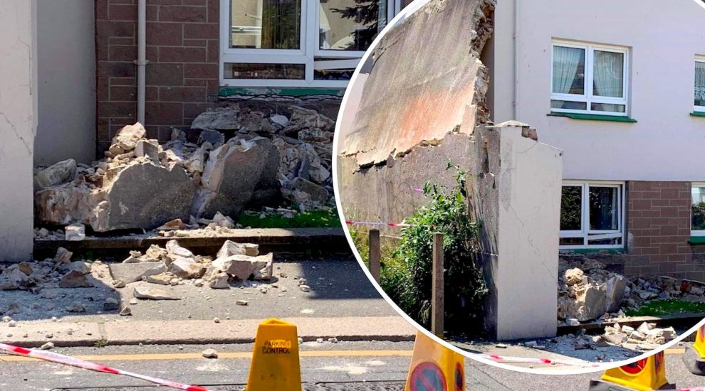 Three moved to hotel after sudden wall collapse