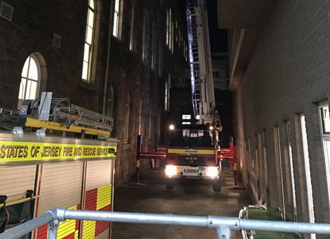 Fire fighters brave high winds to fix hospital roof