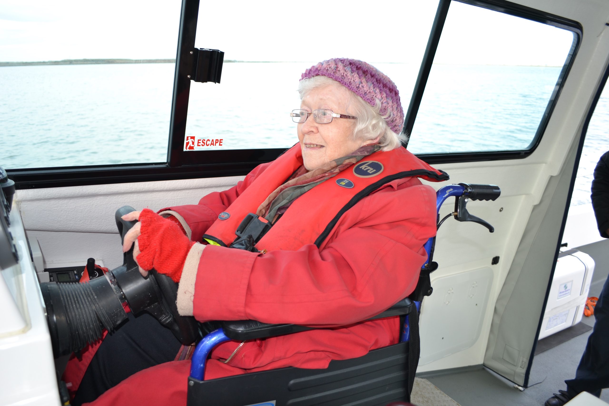 Wheelchair_passenger_at_the_helm.jpg wetwheels