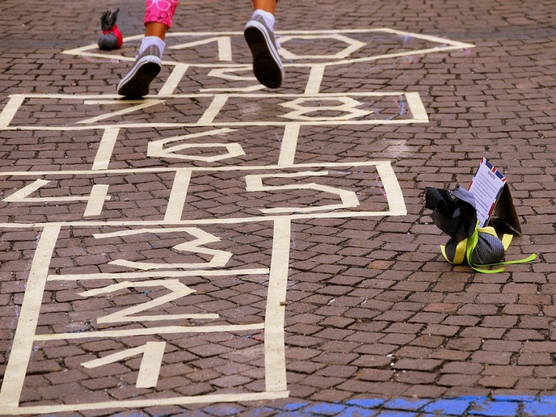 children playing hopscotch