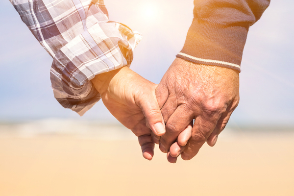 shutterstock holding hands gay couple