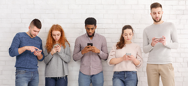 TECH_PHOTO_web_-_students-texting-on-their-smartphones-leaning-on-NJDMALT.jpg