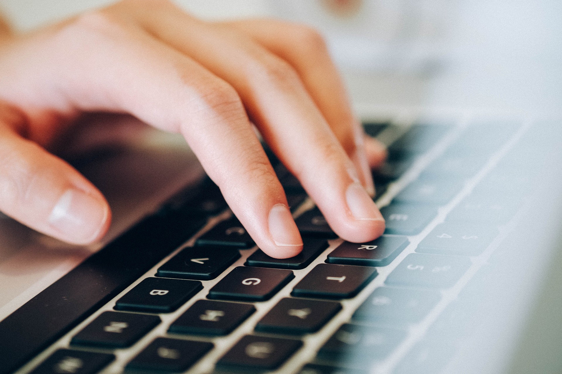 hand_on_laptop.jpg