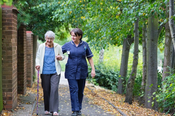 elderly_nurse_walking.jpg