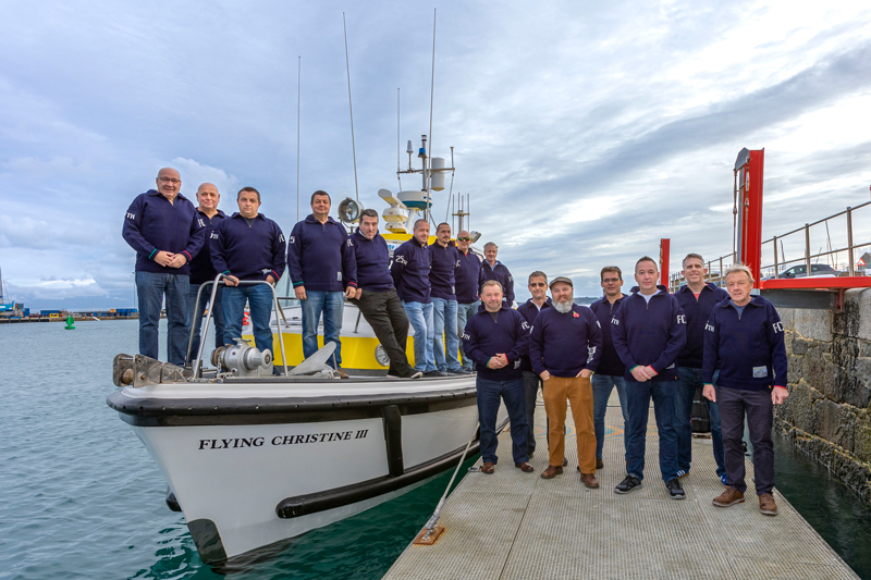 Flying Christine III volunteers with Guernsey jumpers - credit Chris George