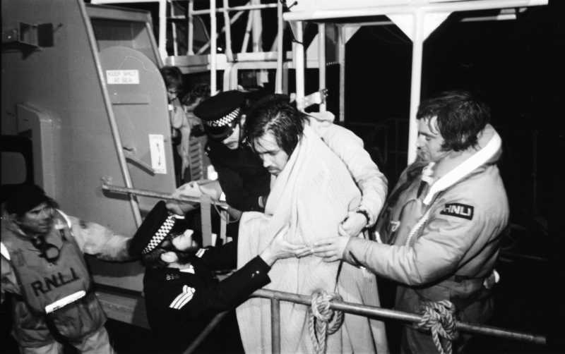 A_rescued_crewman_being_taken_off_lifeboat_credit_Herald_Express.jpg