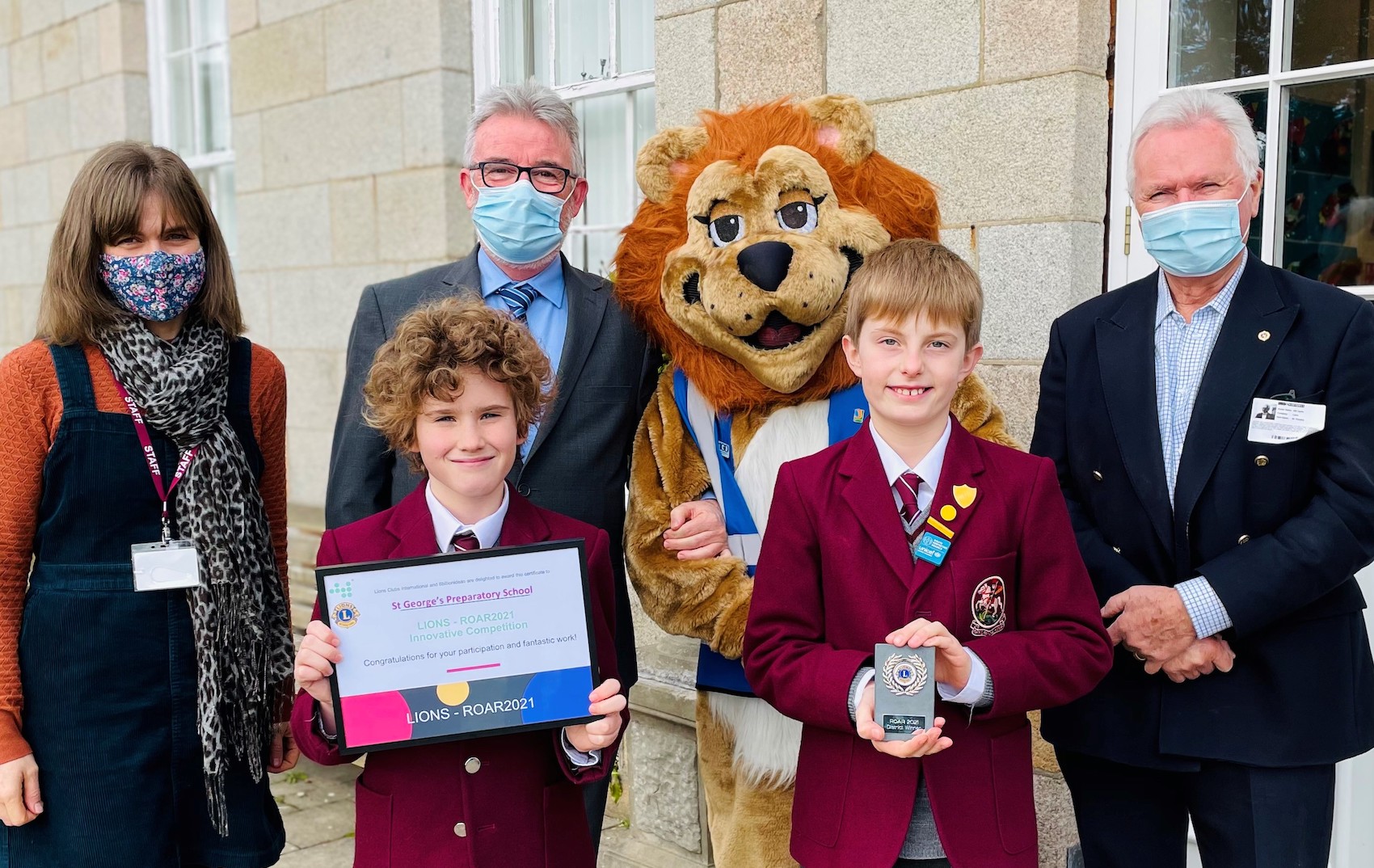 ROAR_winners_Mark_and_Renzo_with_Deputy_Headteacher_Lindsey_Fidrmuc_Headteacher_Cormac_Timothy_Melvin_the_Lion_and_Lion_President_William_Harris.jpg