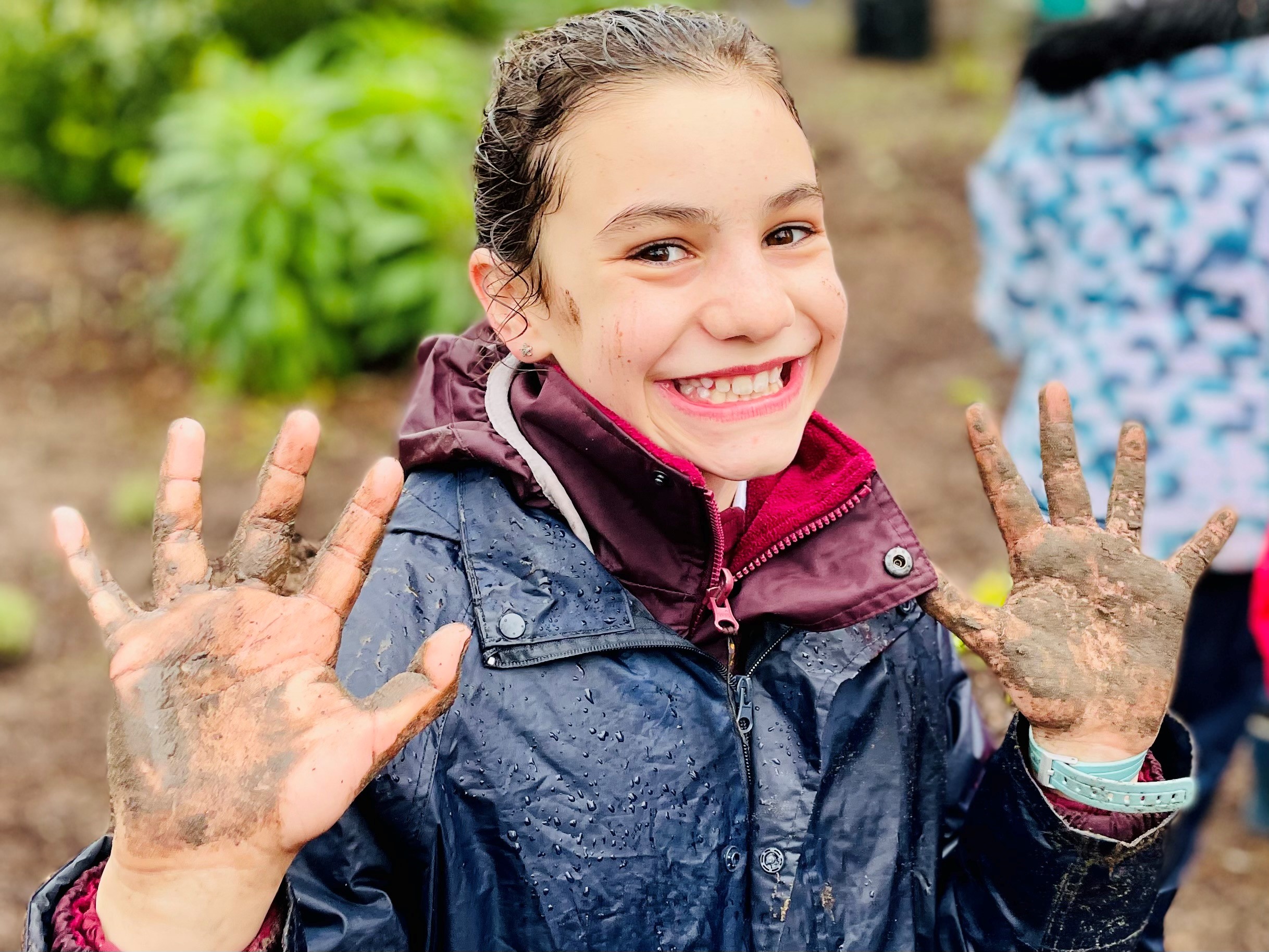 Autumn_from_Form_VI_proudly_shows_her_muddy_hands_from_all_her_hard_work.jpg