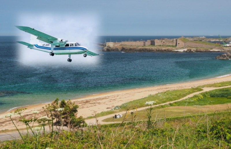 a plane is in the top left corner with one of Alderney's beaches below