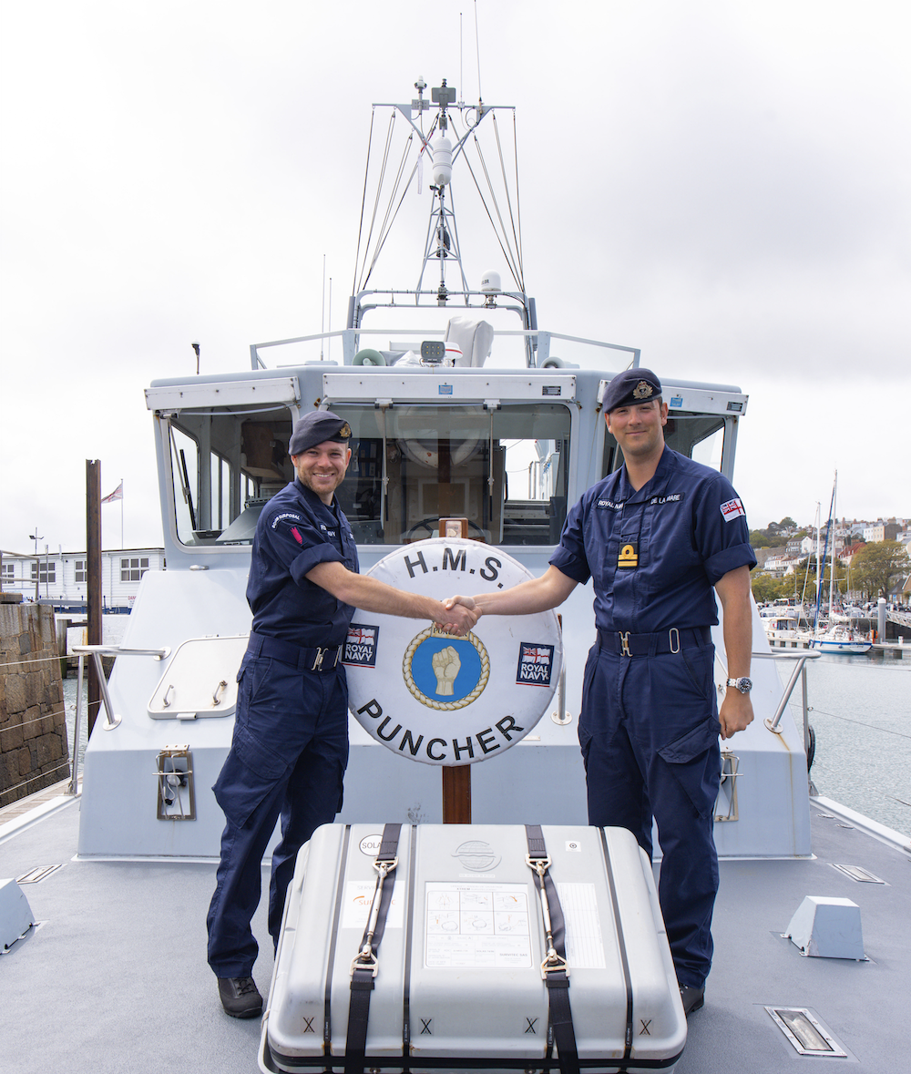 William de la mare (right) aboard HMS Puncher, Guernsey, May 2023