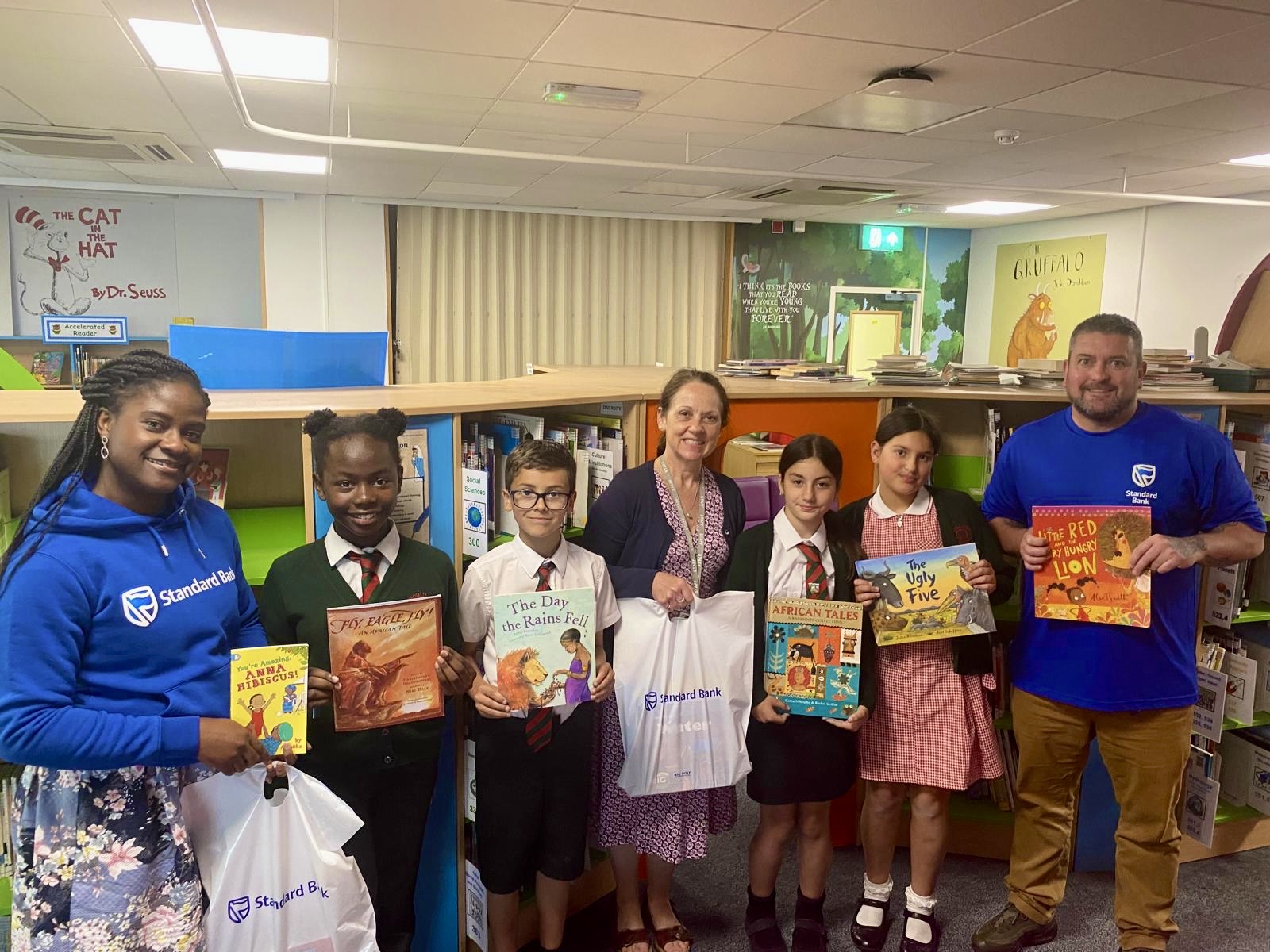 Jael_Crystal-Azah_and_Barry_Cairney_of_Standard_Bank_with_Rouge_Bouillon_staff_and_students.jpg