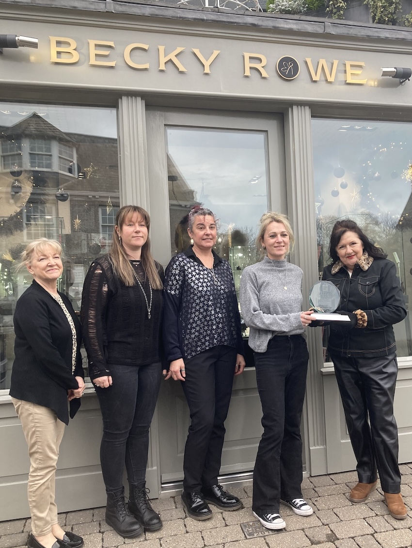 2024_12_09_Becky_Rowe_being_presented_with_the_2023_trophy_for_out_of_town_Christmas_window_display.jpg