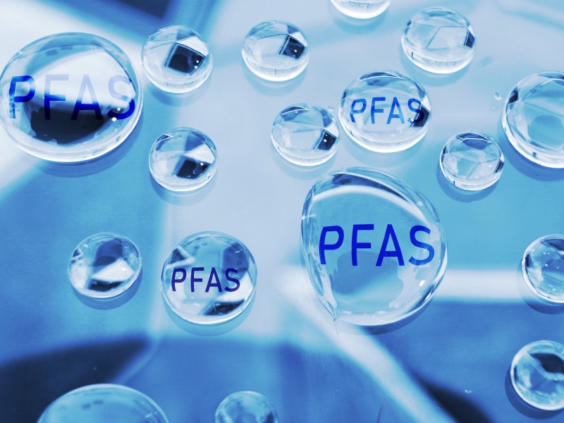Water drops with PFAS text -- Forever chemical water contamination concept