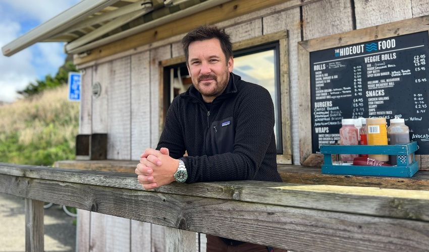 man in front of cafe