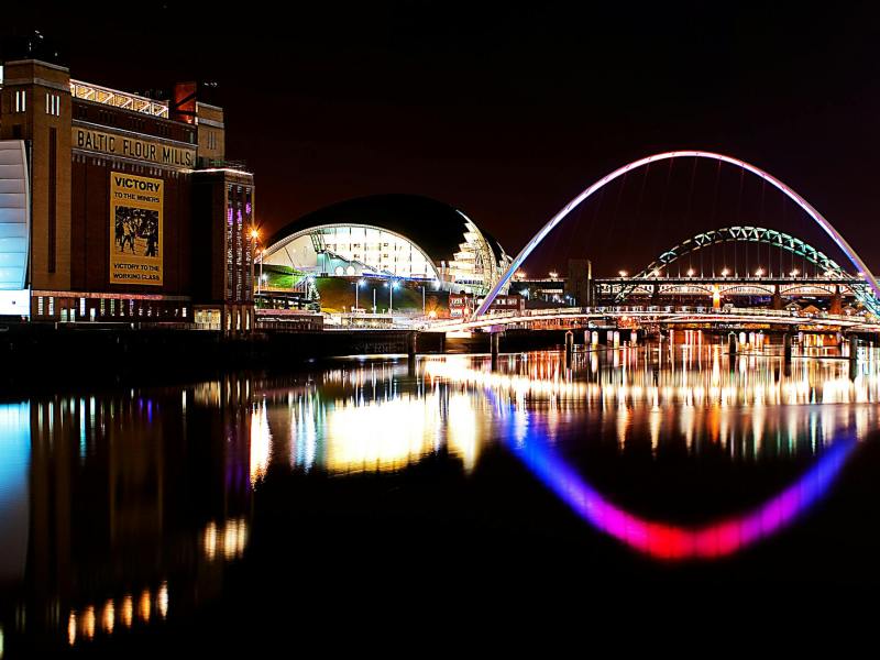 building beside bridge at night
