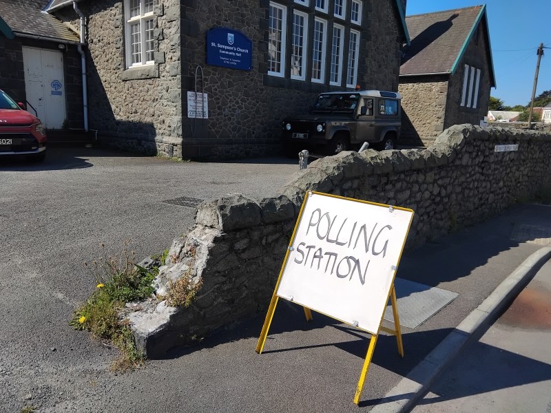 A Polling Station sign.