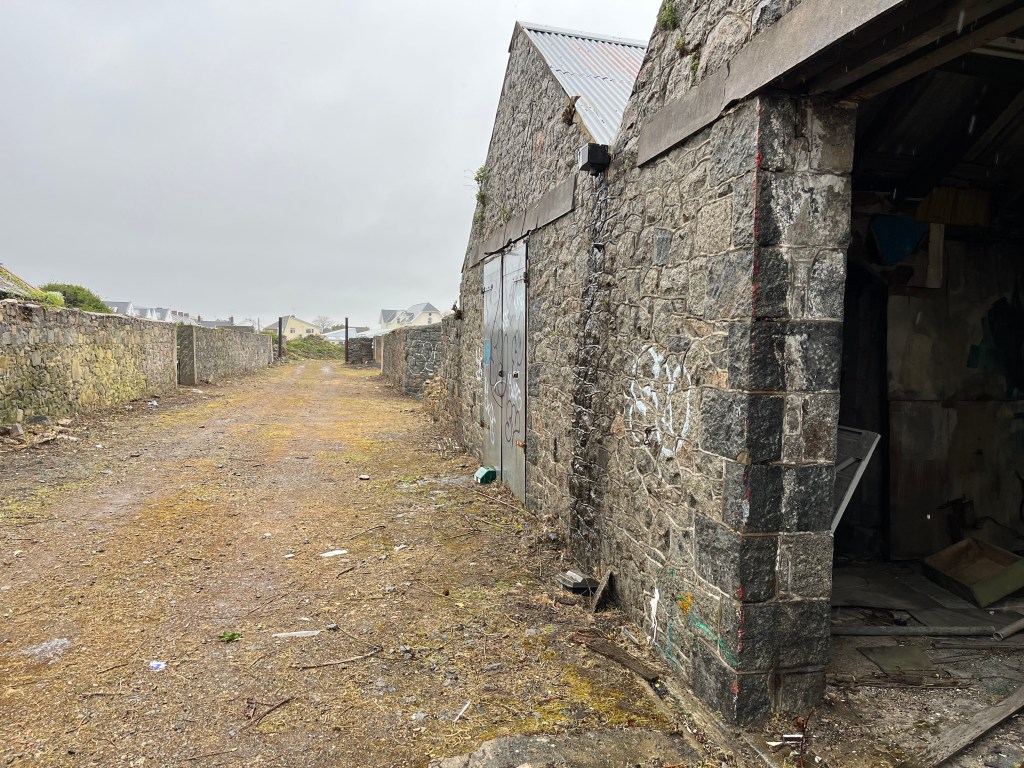 Several old granite industrial buildings.