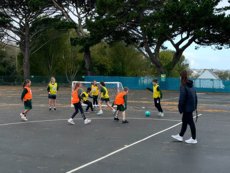 Several girls playing football