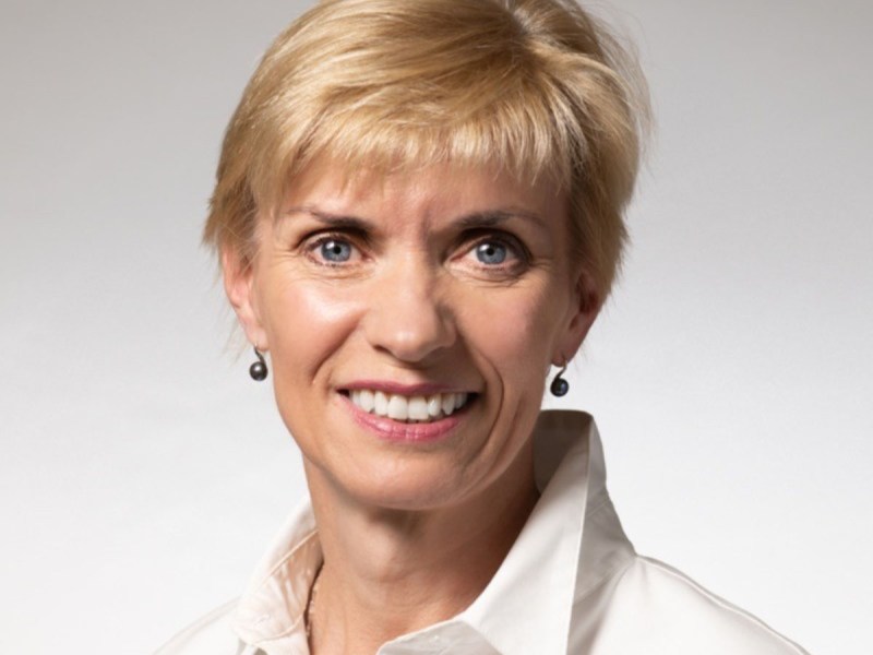 A blonde woman with short hair.