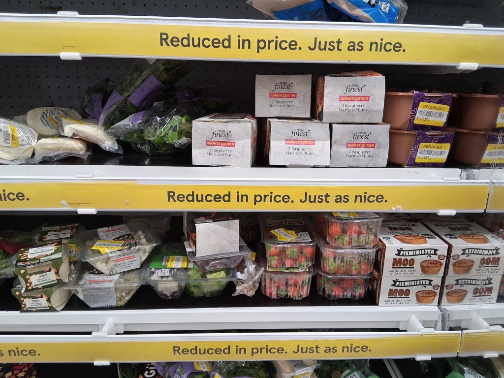 A shelf of yellow stickered goods