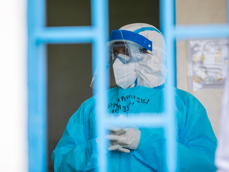 Kigali, Rwanda – October 17, 2022: Medical personnel in full protective gear transport a simulated patient during an Ebola preparedness drill at King Faisal Hospital in Kigali.
