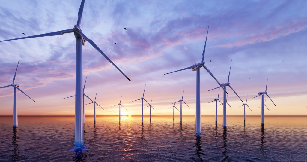 Windmill park. Offshore wind turbines farm on the ocean. Sustainable energy production. Green Energy, clean power, clean energy concept.