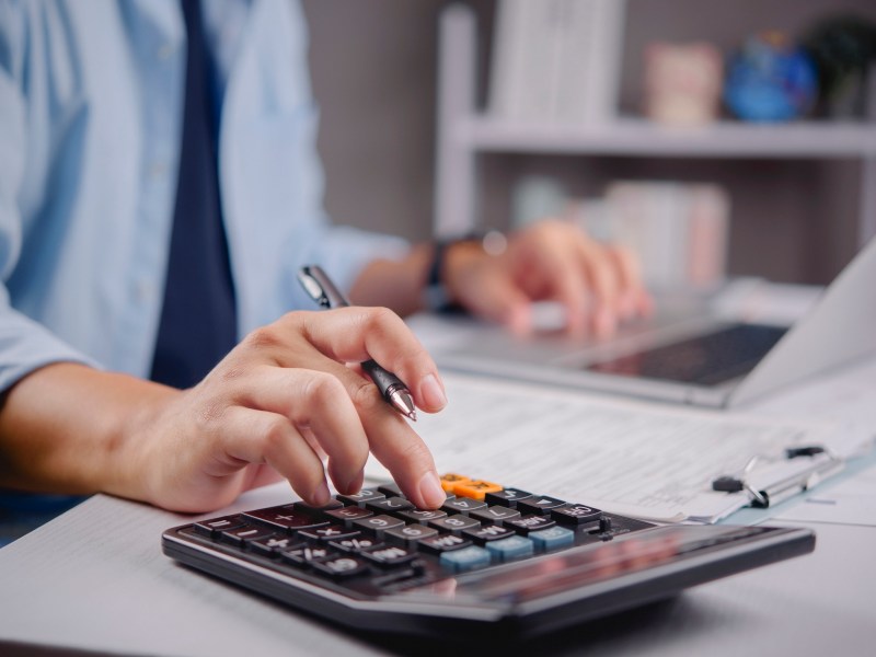 Business finance accounting budget tax calculation data entry economy concept analyzing financial report.