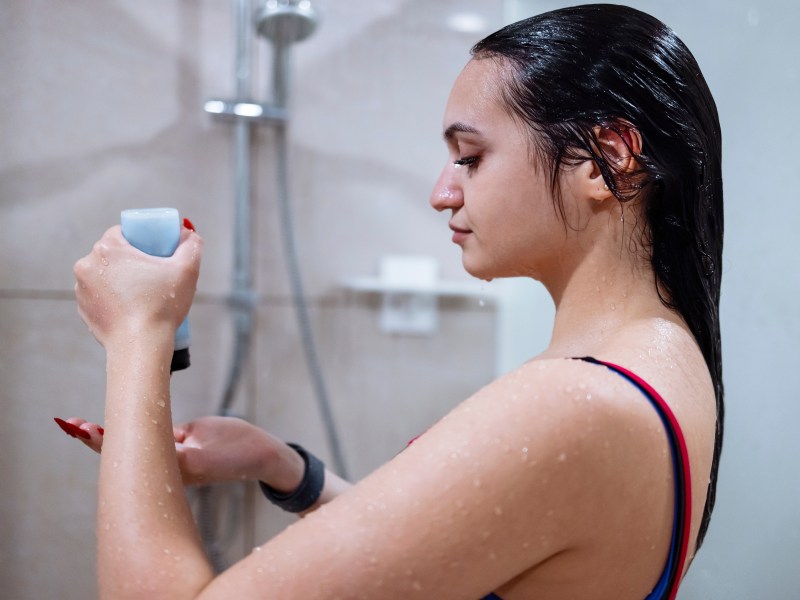 Beautiful,Smiling,Young,Brunette,Woman,Taking,A,Shower,In,Gym.