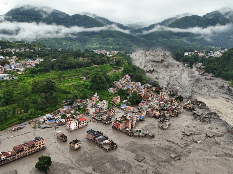A drone shot of houses in the aftermath of the floods
