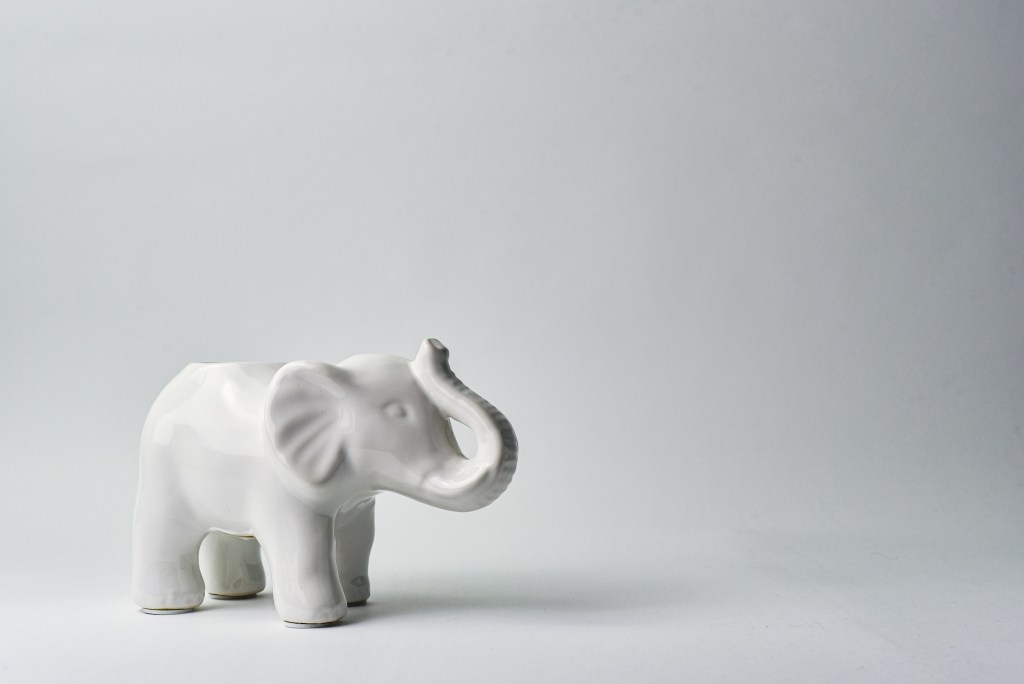 White lephant statue against a white background